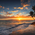 Sunrise on a Hawaiian island. Palm trees on sandy beach.